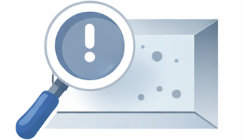Magnifying glass examining mold or dirt on a surface with an exclamation mark symbol in a circle.