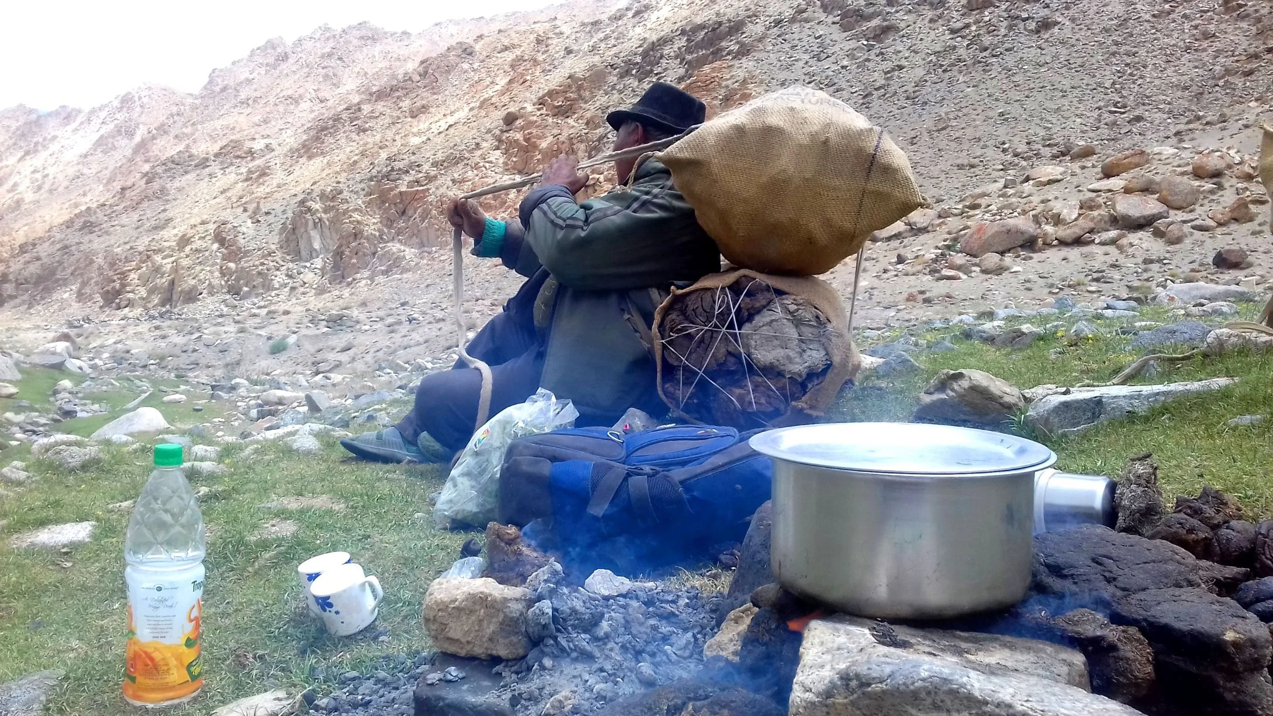 Abbale getting ready to carry home the cattle dung with sacks and ropes 