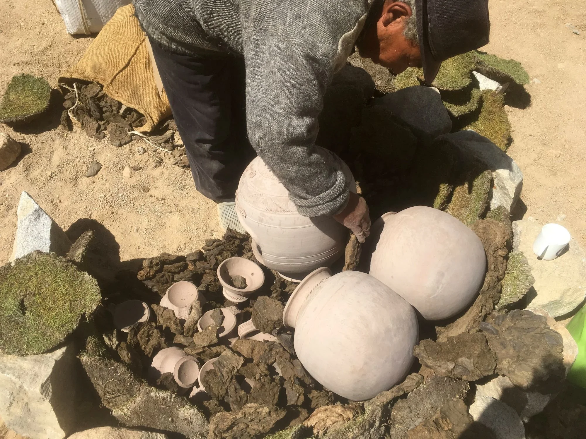 Abbale adding wares to the kiln