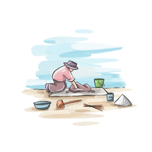 A person wearing a hat working preparing clay, kneeling on the ground with various tools and buckets around them.