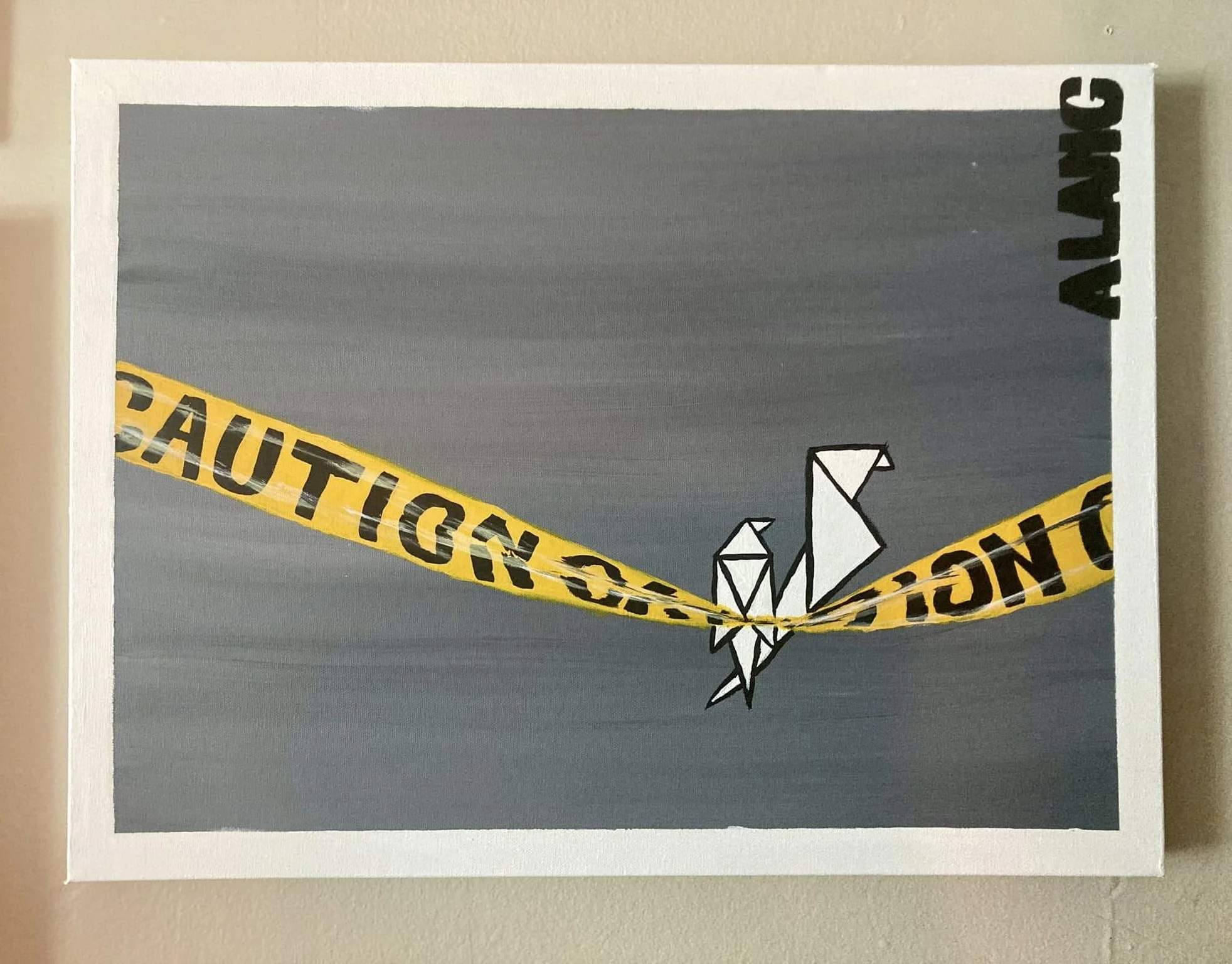 An artwork depicting origami birds with yellow caution tape labeled 'CAUTION' crossing through the center, set against a gray background.