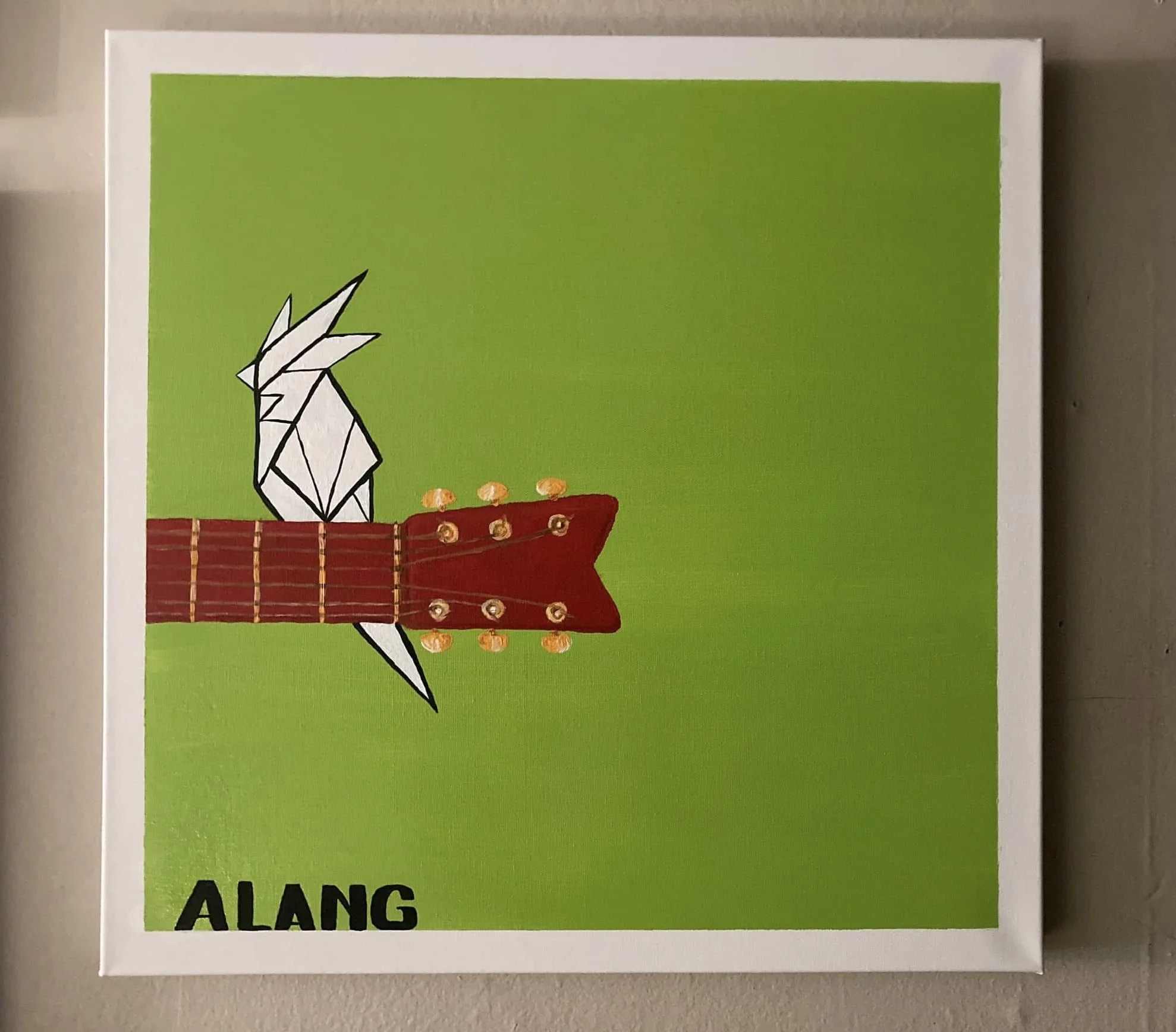 A colorful artwork of a white geometric bird with large pointed beak and crest, and a red guitar neck with tuning pegs, set against a bright green background, with the word 'ALANG' in black at the bottom.