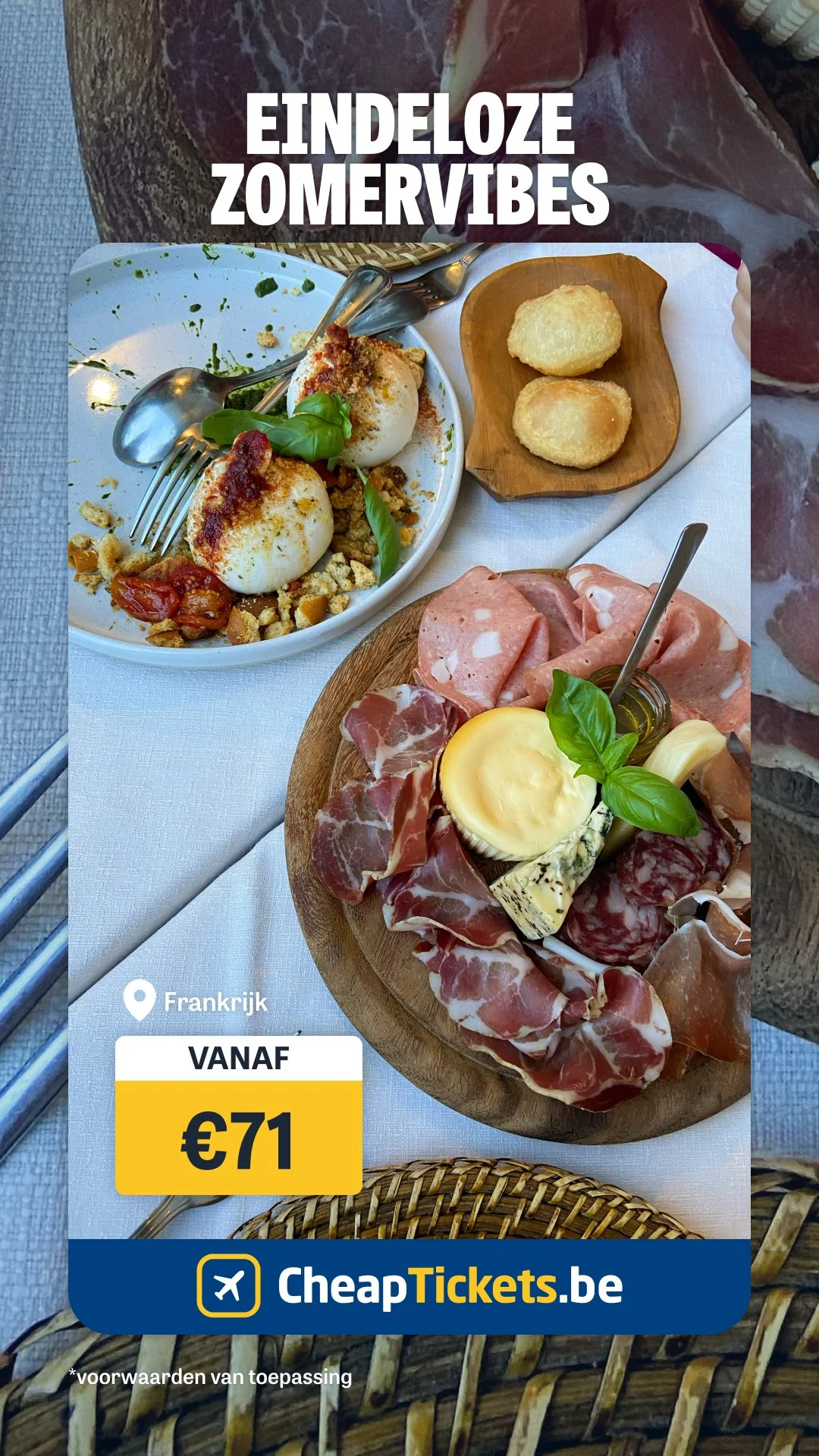 A table filled with Italian-style food, including a charcuterie board with various meats and cheeses, mozzarella balls with tomato and herbs, and a small dish of fried cheese or potato croquettes. There is also a small wooden plate with two breaded f