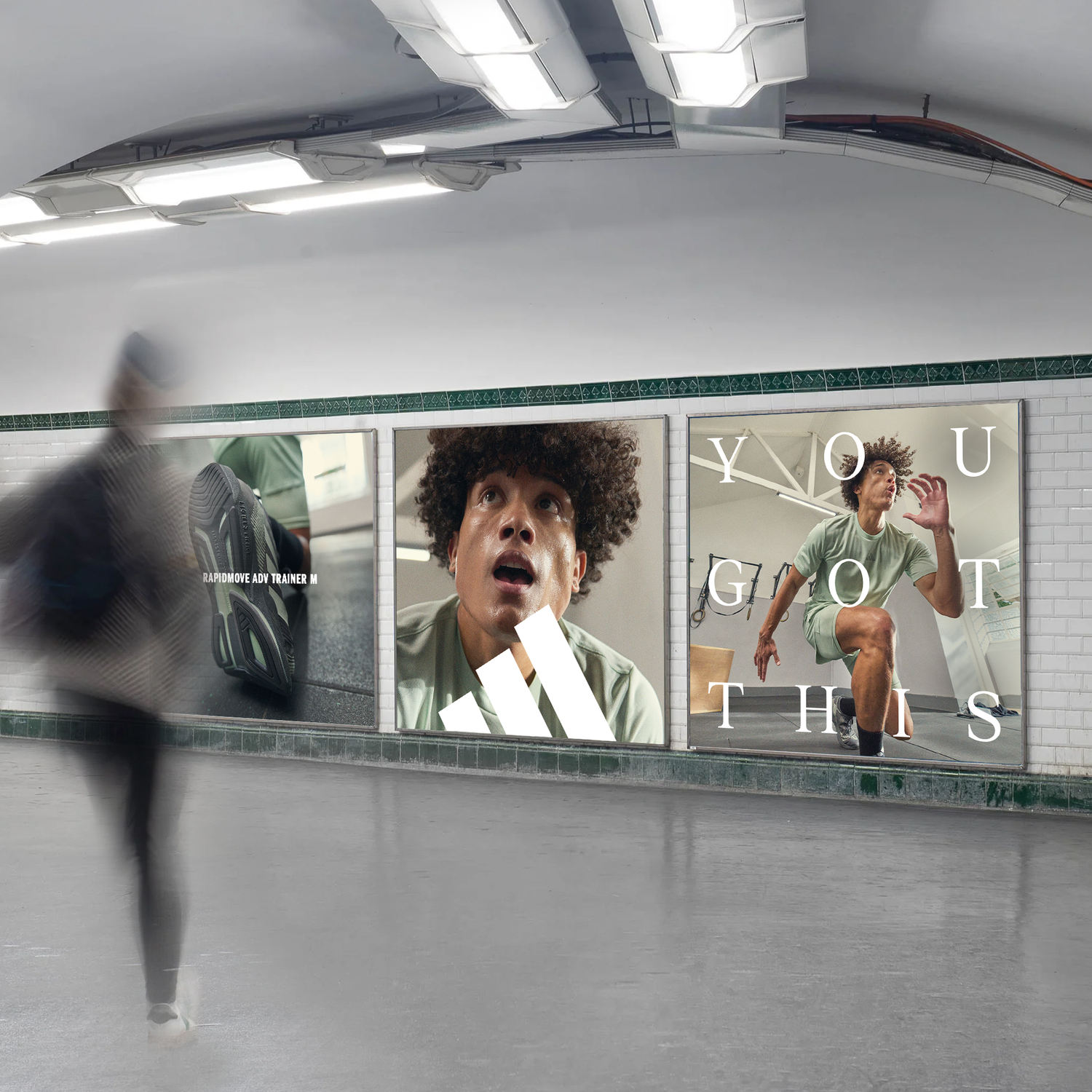 Underpass featuring three fitness advertisements with a blurred person running through.