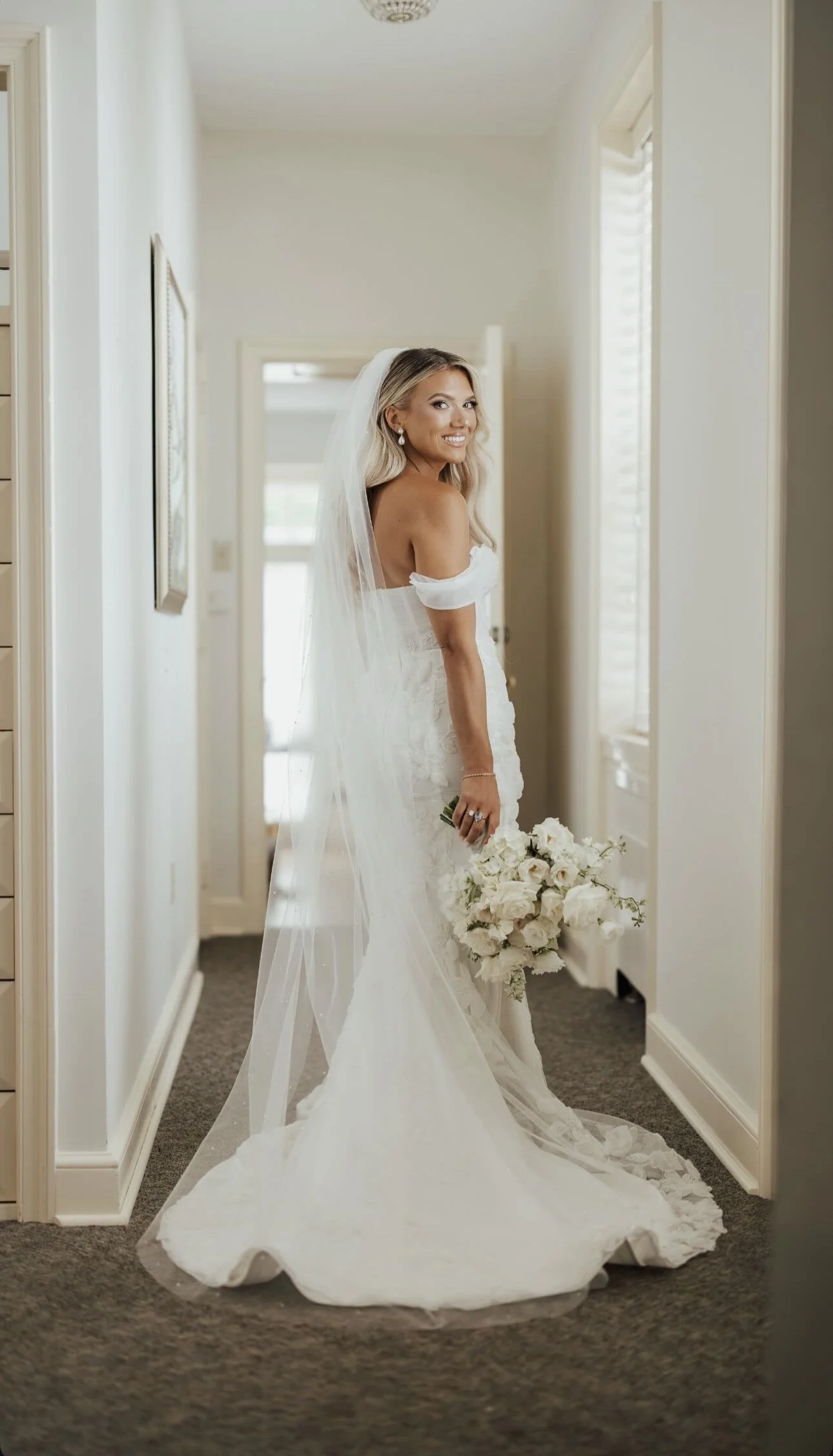 Bride getting ready for her wedding. TLC Bridal on location hair in Levittown, Pa. Taylor Cline, Bridal glam waves, timeless bridal hair, bridal bun, luxury bridal hair, bridal for brides based in Levittown, Pa