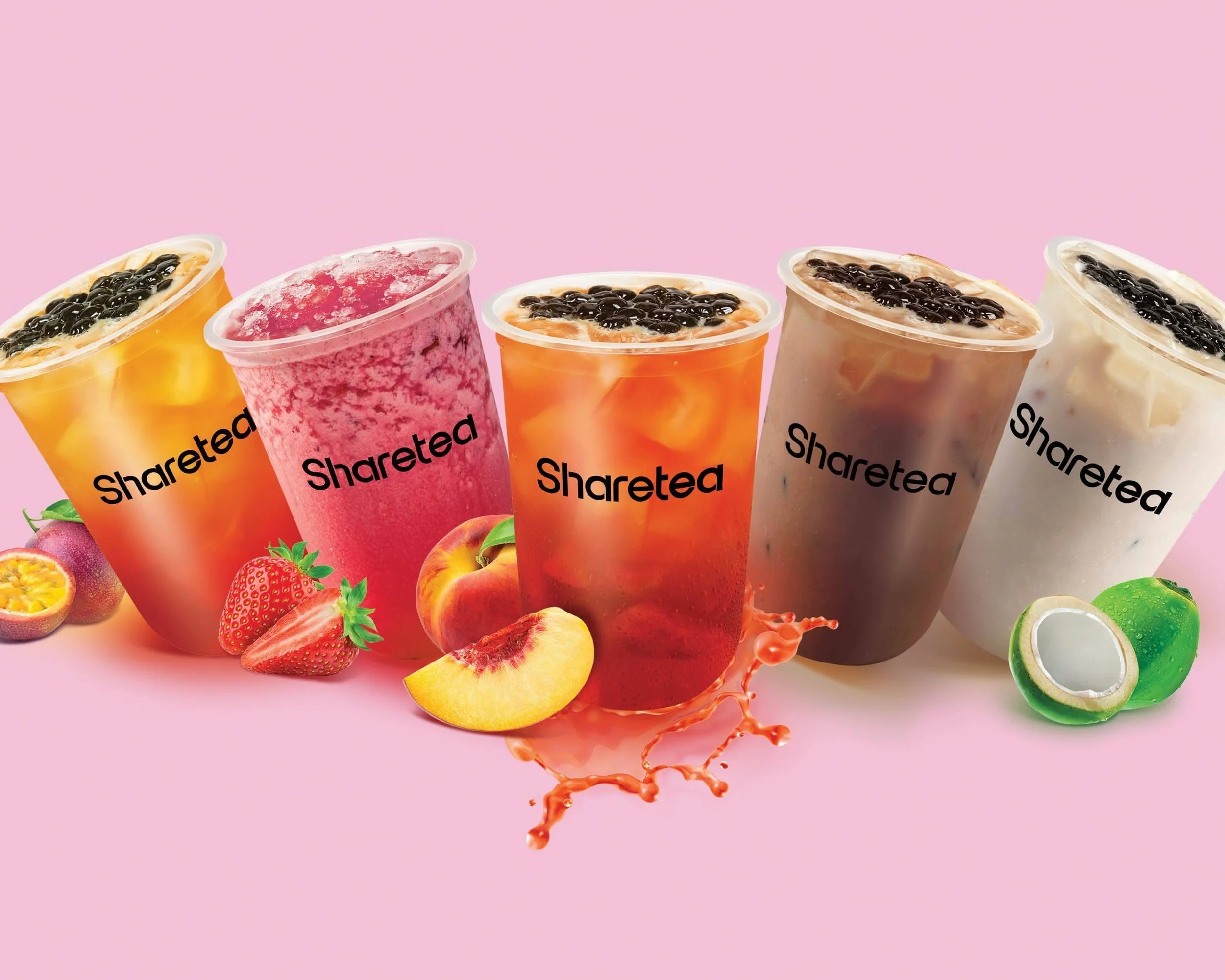 Five colorful bubble tea drinks with pearls on top, labeled 'Shareted', with fresh fruit like strawberries, peaches, passion fruit, and a lychee around them, against a pink background.
