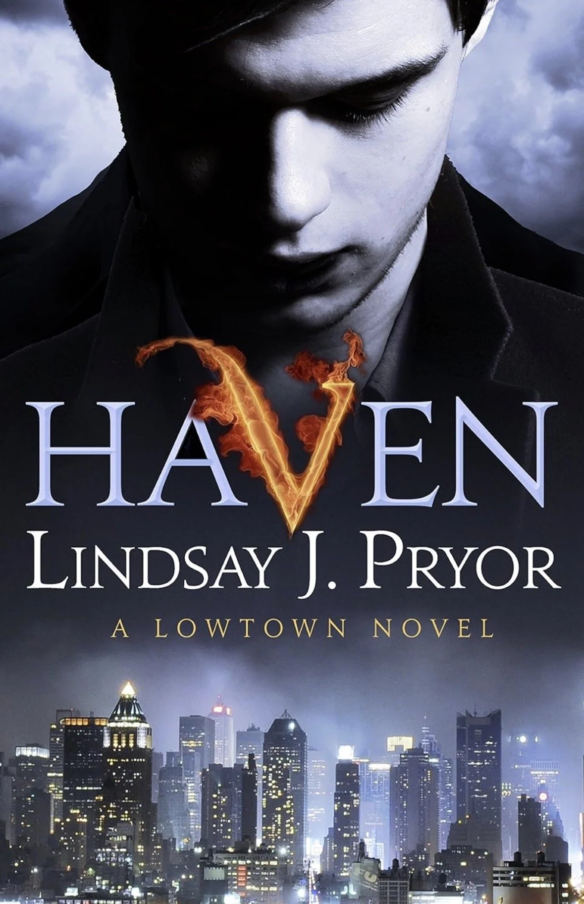 Book cover for 'Vixen' by Lindsay J. Pryor featuring a young man with dark hair and pale skin looking down, set against a moody cityscape at night with dark clouds.