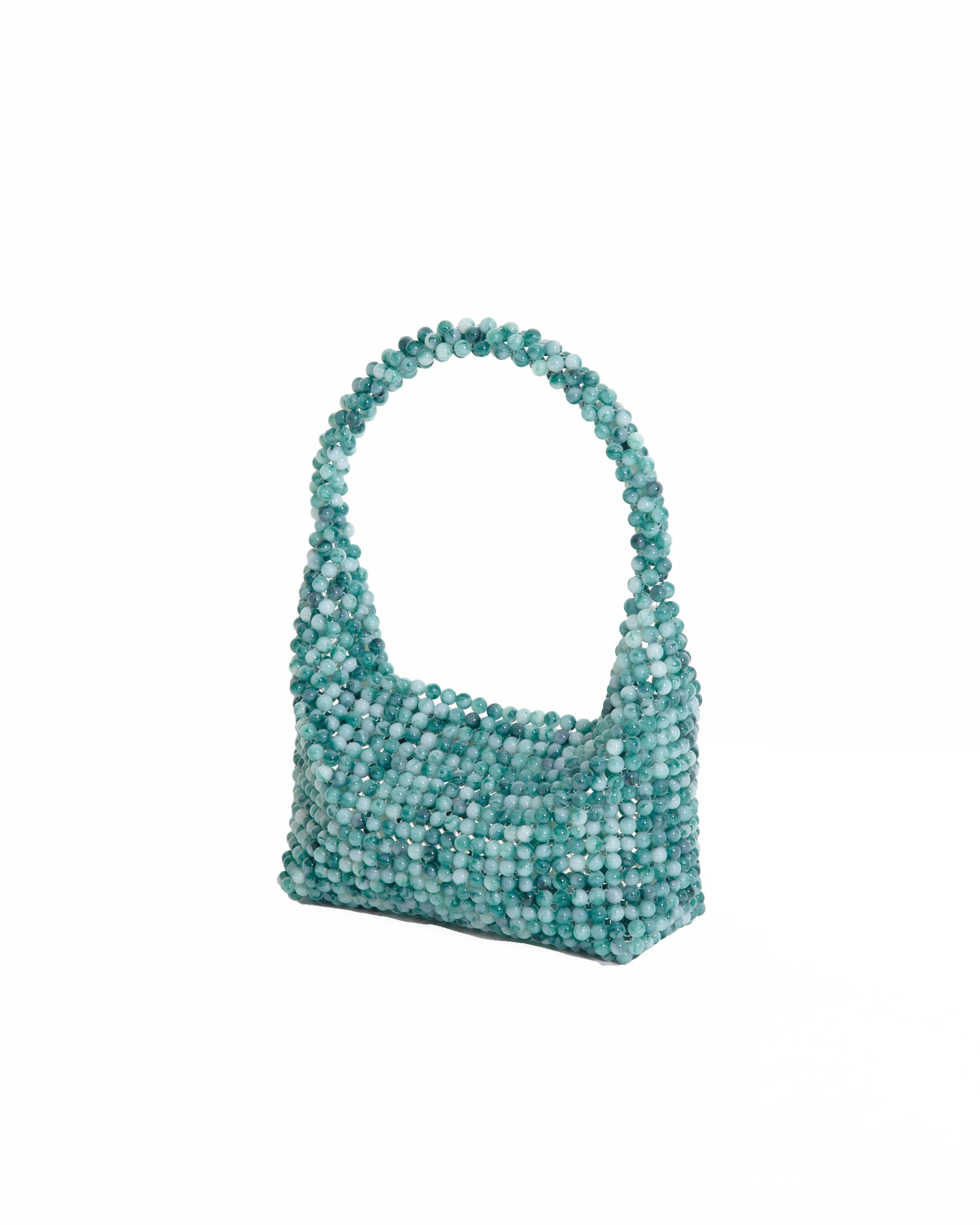 A handbag decorated with small, round, light blue beads.