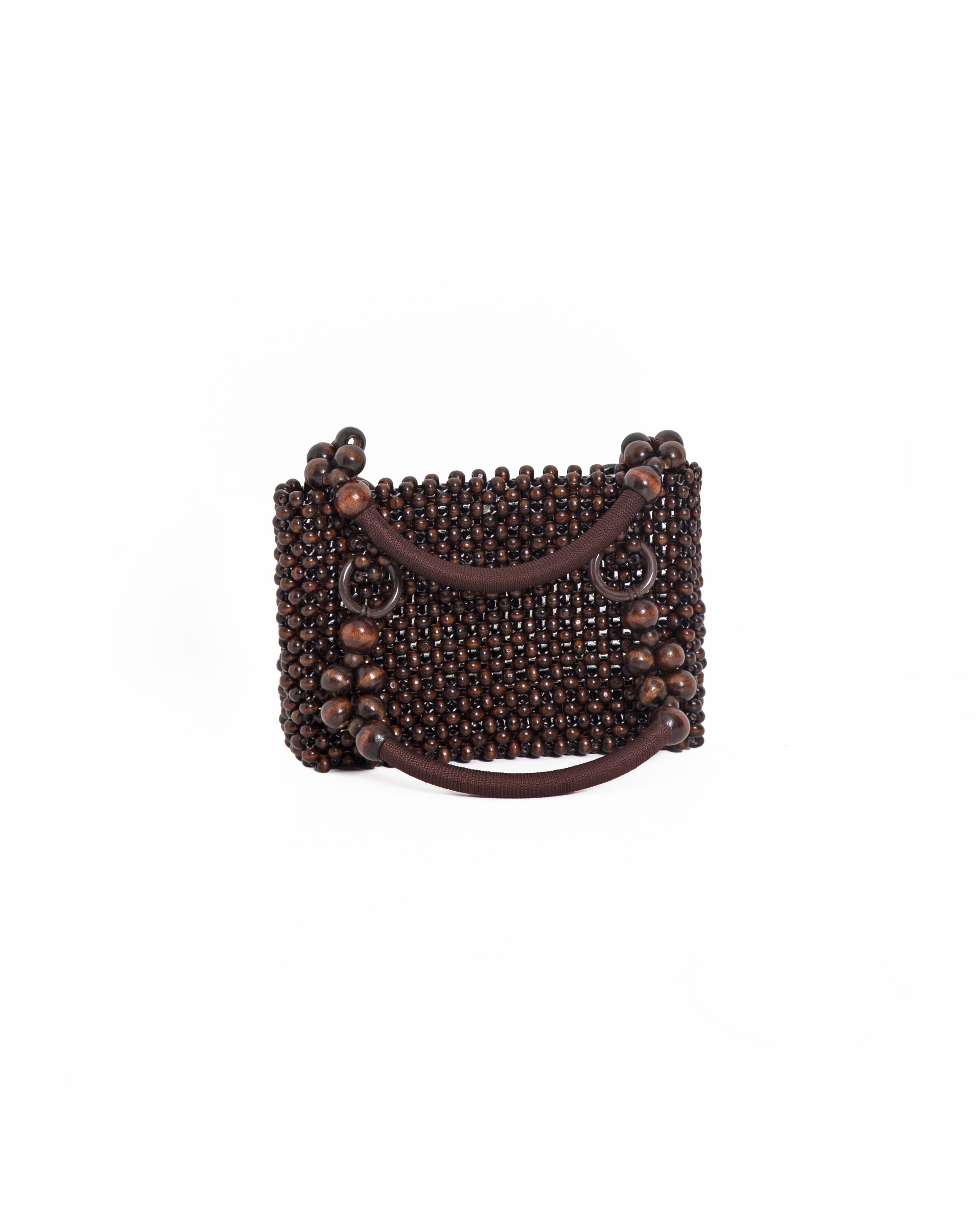 Brown handbag made of beads with handles and decorative rings.