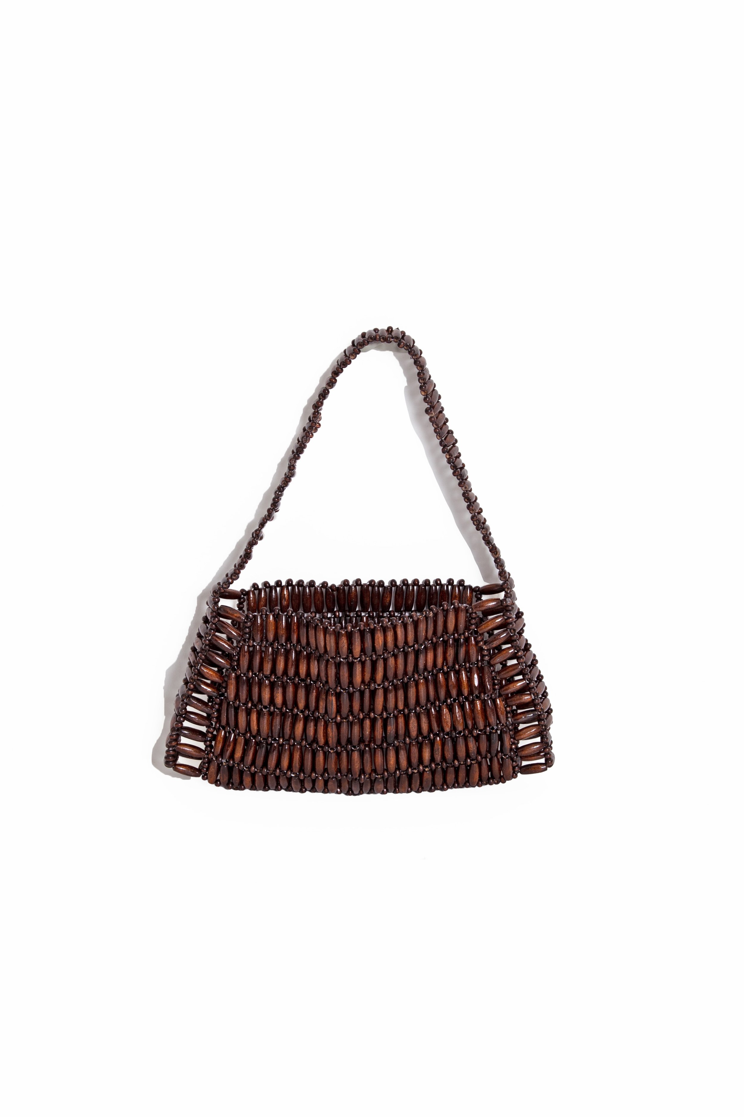 A handbag made from dark brown beads, featuring a woven design with a single strap.