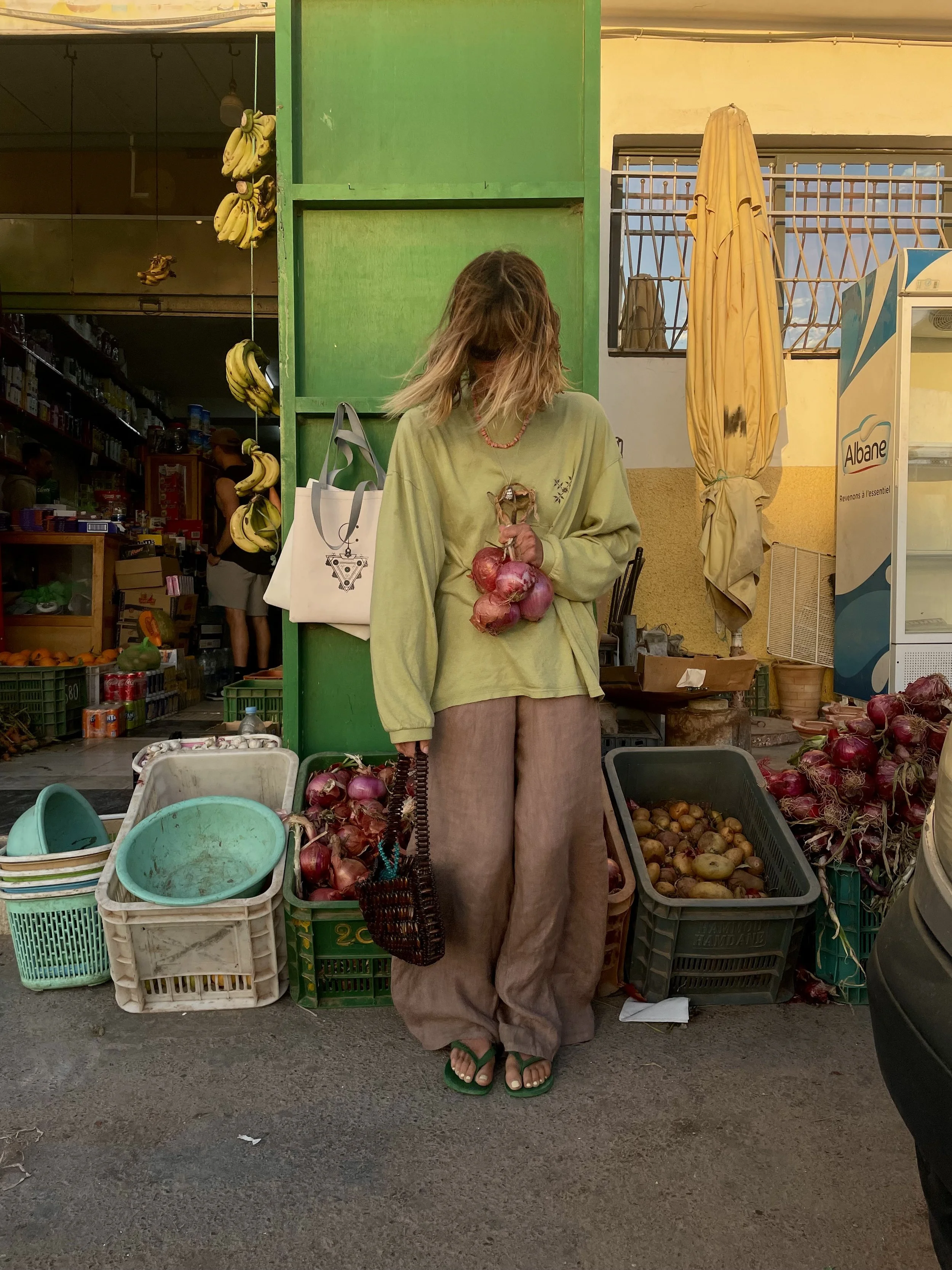 Alicia in her personalized wooden bag grocery shopping in Morocco.