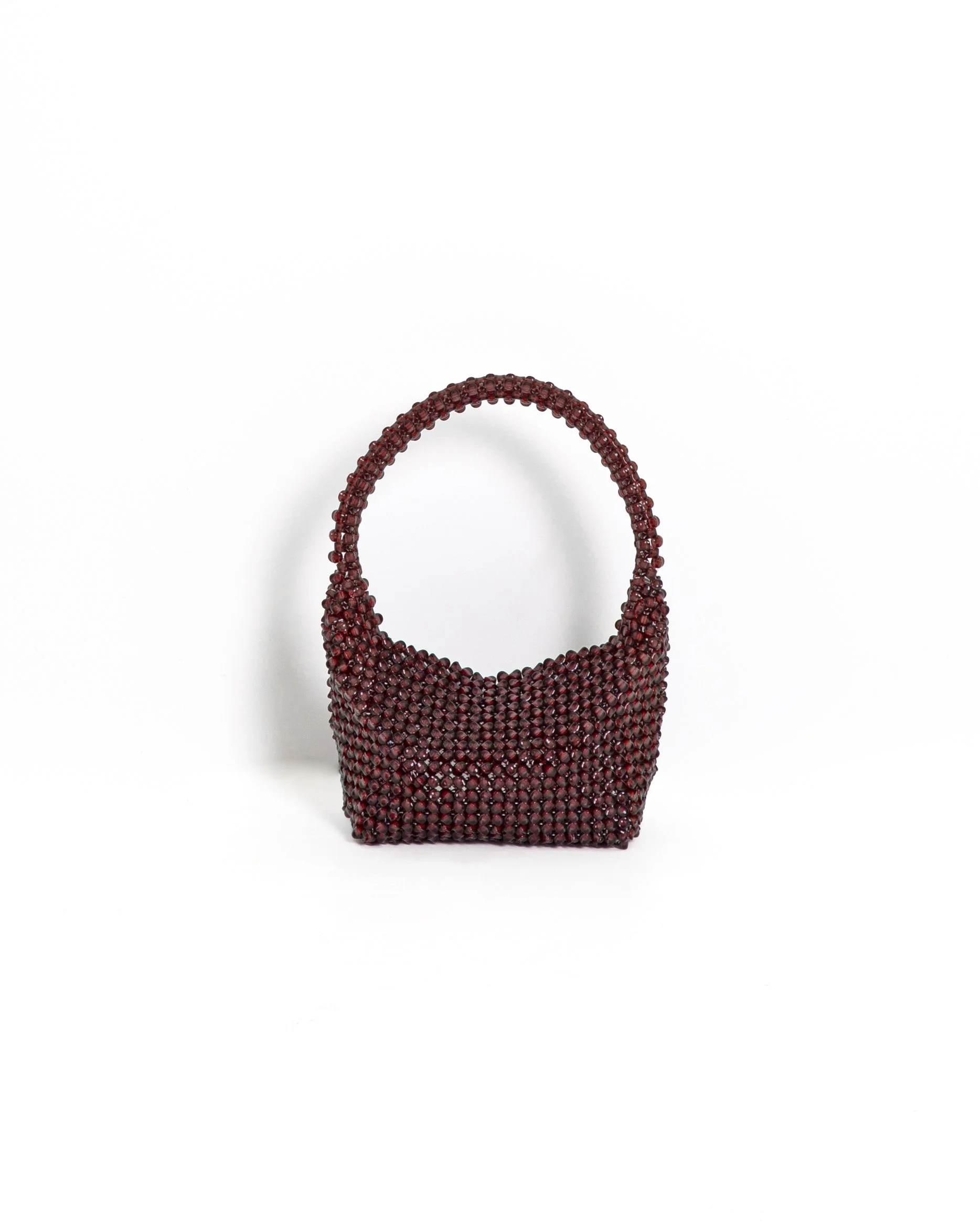 Beaded burgundy handbag on white background.