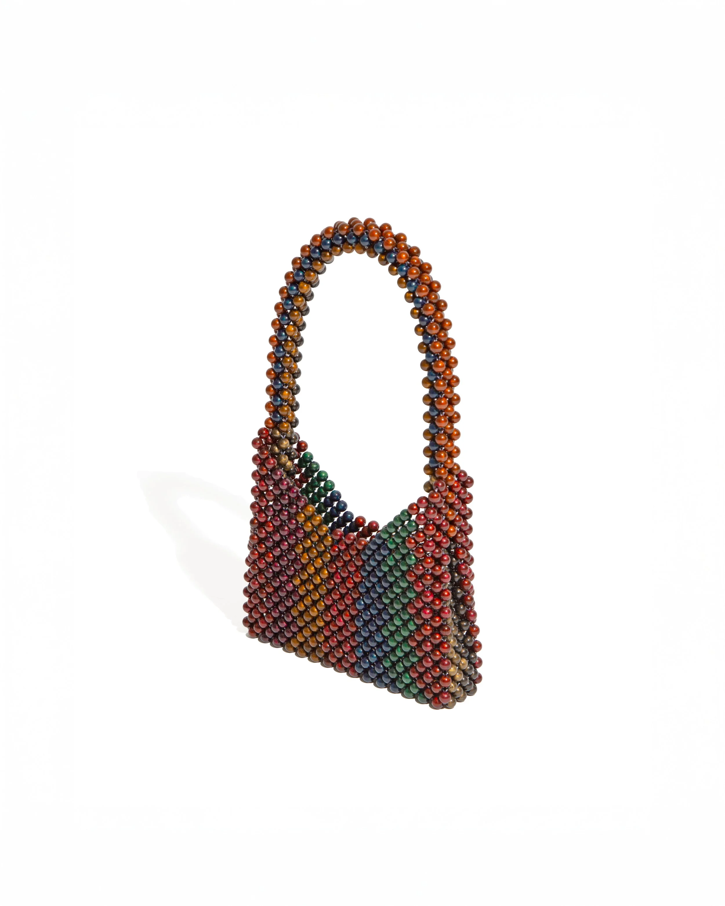 Colorful beaded handbag sculpture made of small, round beads arranged in a curved shape against a white background.