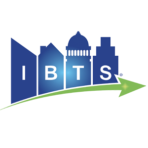 A stylized city skyline with tall buildings, and a green arrow pointing right, with the letters 'IBTS' above the arrow.