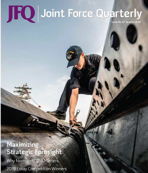 Cover of Joint Force Quarterly magazine featuring a person in military uniform working on a submarine.