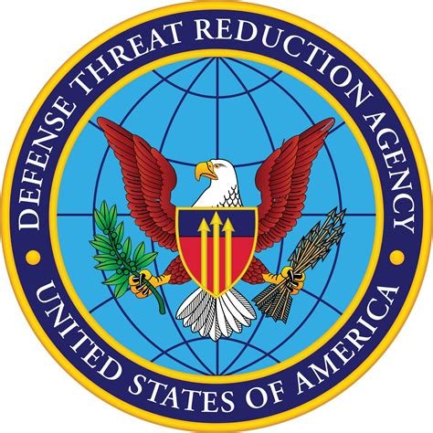 The official seal of the Defense Threat Reduction Agency of the United States of America featuring a bald eagle with outstretched wings, holding a branch of laurel and arrows, with a shield on its chest, over a globe background.