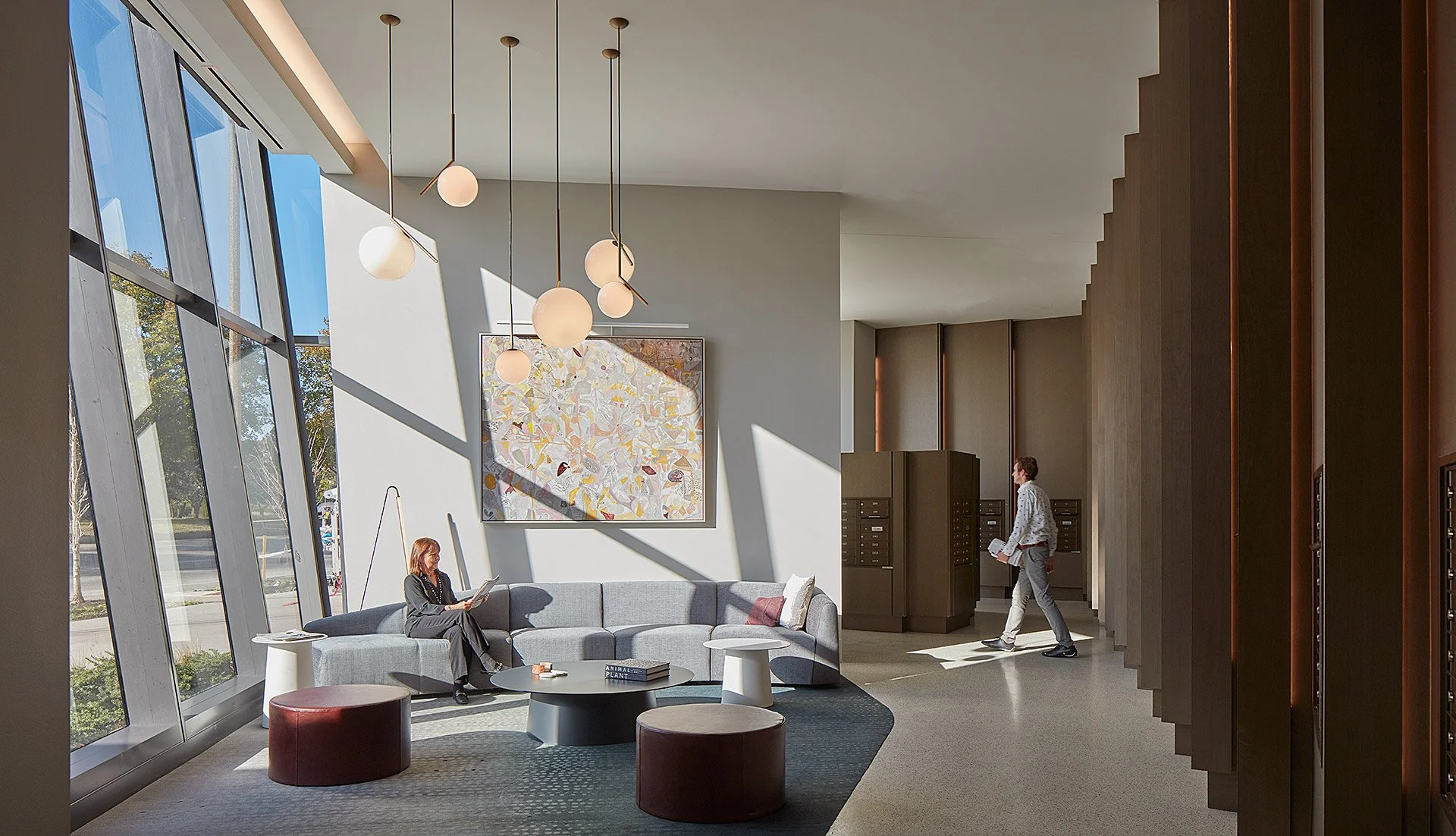 Large framed painting in the lobby of a residential apartment building in St. Louis illustrating DeGroot Fine Art fine art consulting services for residential clients featured in Selected Work