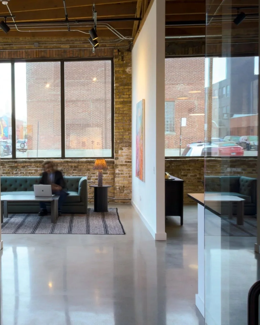 A DeGroot Fine Art consultant working at the studio in Chicago illustrating the firm’s accessible and responsive fine art consulting services available through the Connect page.