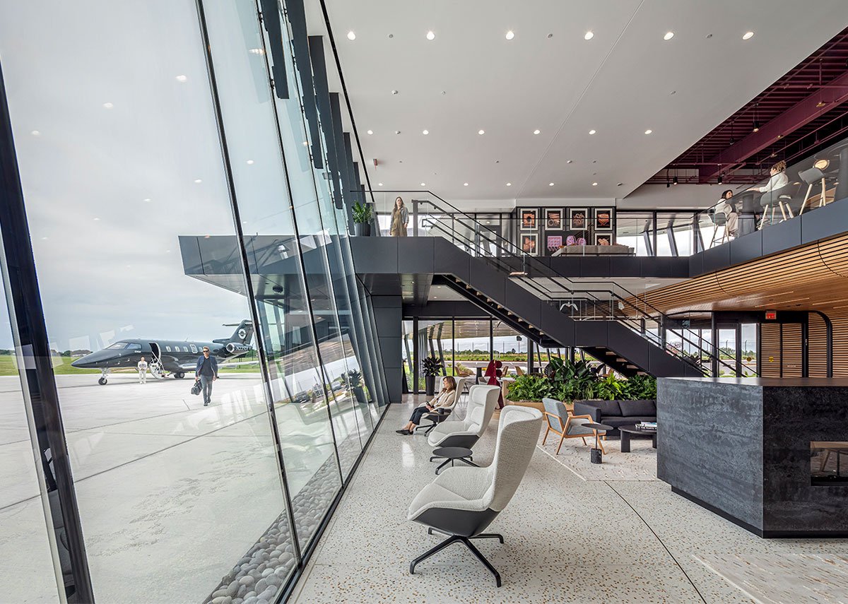 A private airport terminal with framed artwork and sculpture — DeGroot Fine Art provides fine art consulting services for aviation sector clients.
