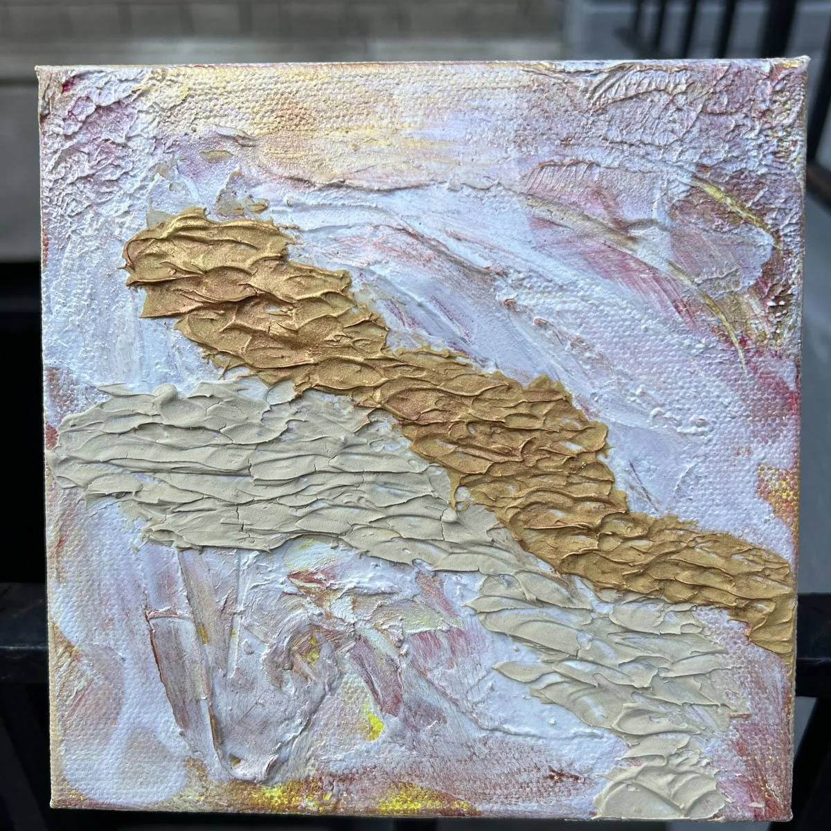 Small 6x6 abstract impasto painting titled Road to Nowhere, featuring a central path of heavily textured gold paint set against a white, pink, and beige background.