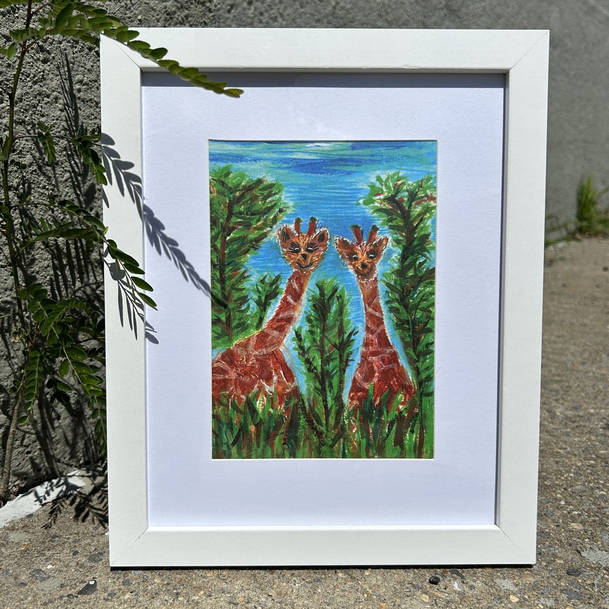 Giraffe Twins print in a white frame with white matting for animal art lovers