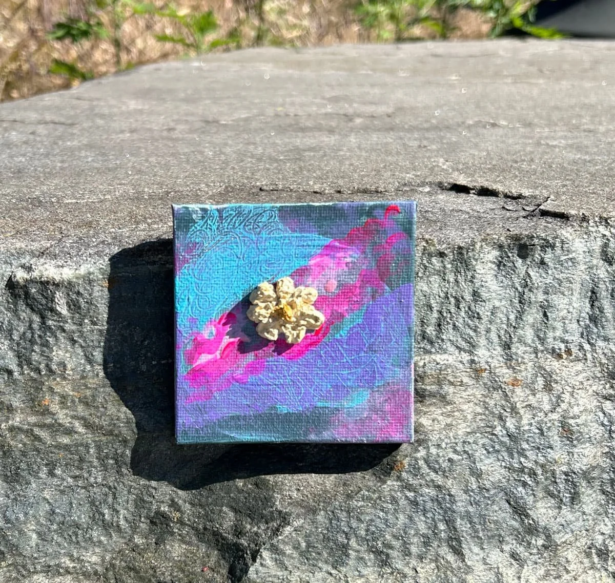 Mini canvas of turquoise and neon pink with a yellow clay flower by artist NYC Heather Collis titled Lemon Sugar Cookie