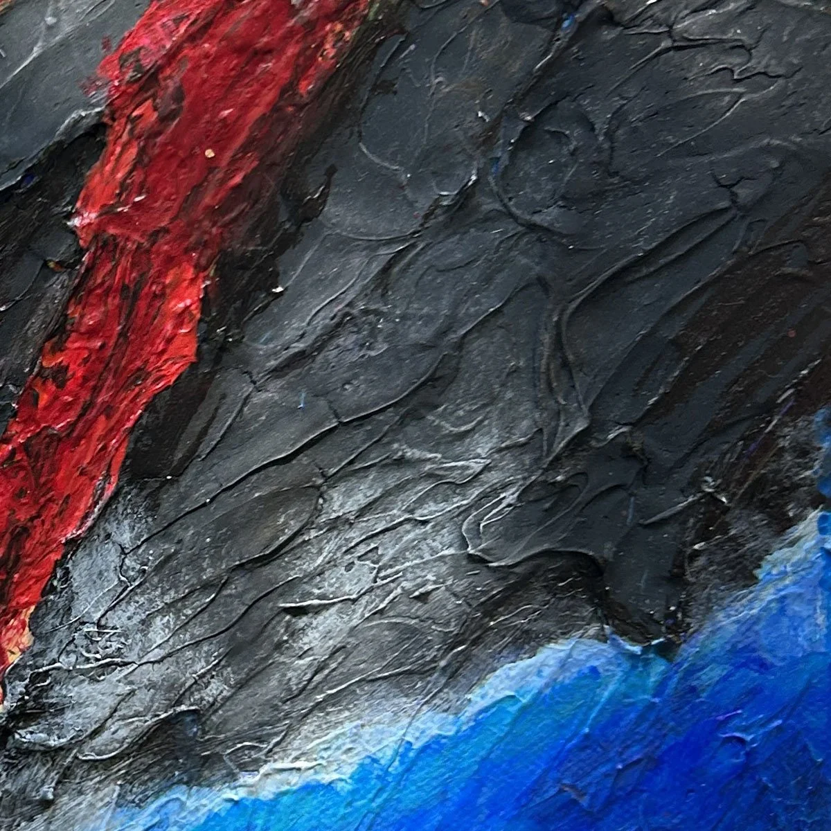 Macro view highlighting heavy dimensional black acrylic rock texture contrasted against a bright red molten lava river by Heather Collis