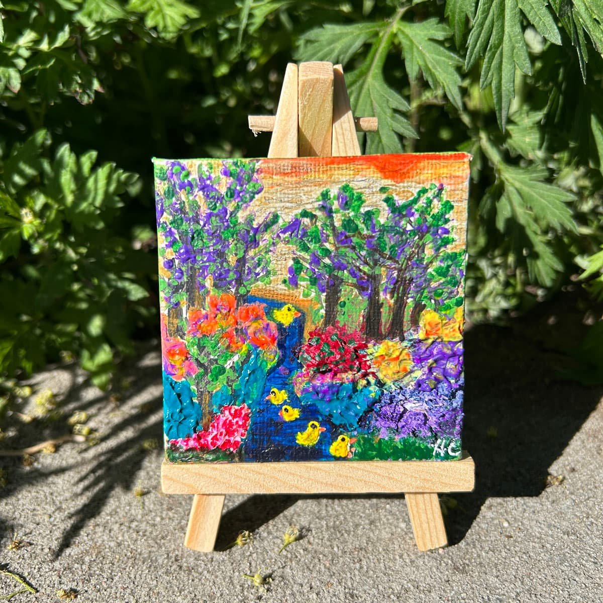 Chicks Swimming mini 3x3 painting on an easel with textured abstract flowers