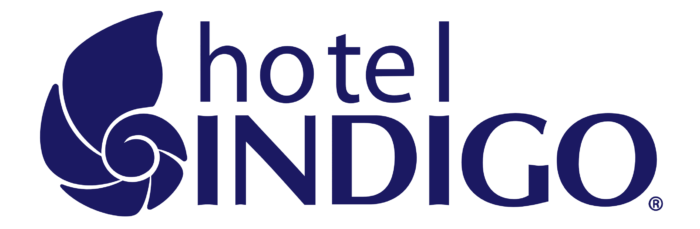 Hotel Indigo logo featuring a stylized purple shell design with the words "hotel INIGO" in dark blue.