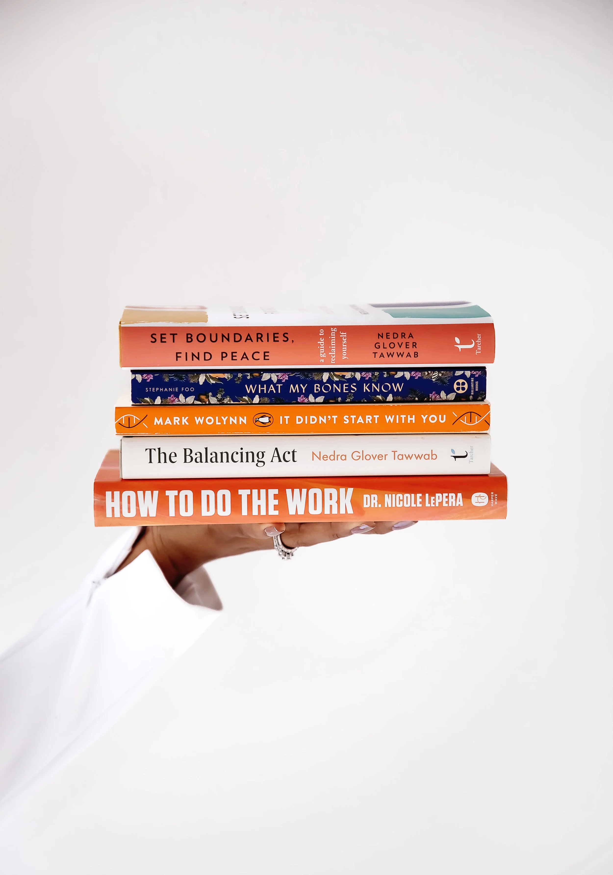 Stack of Self Help books: Set Boundaries, Find Peace, What My Bones Know, It Didn't Start with You, The Balancing Act, How to do the Work