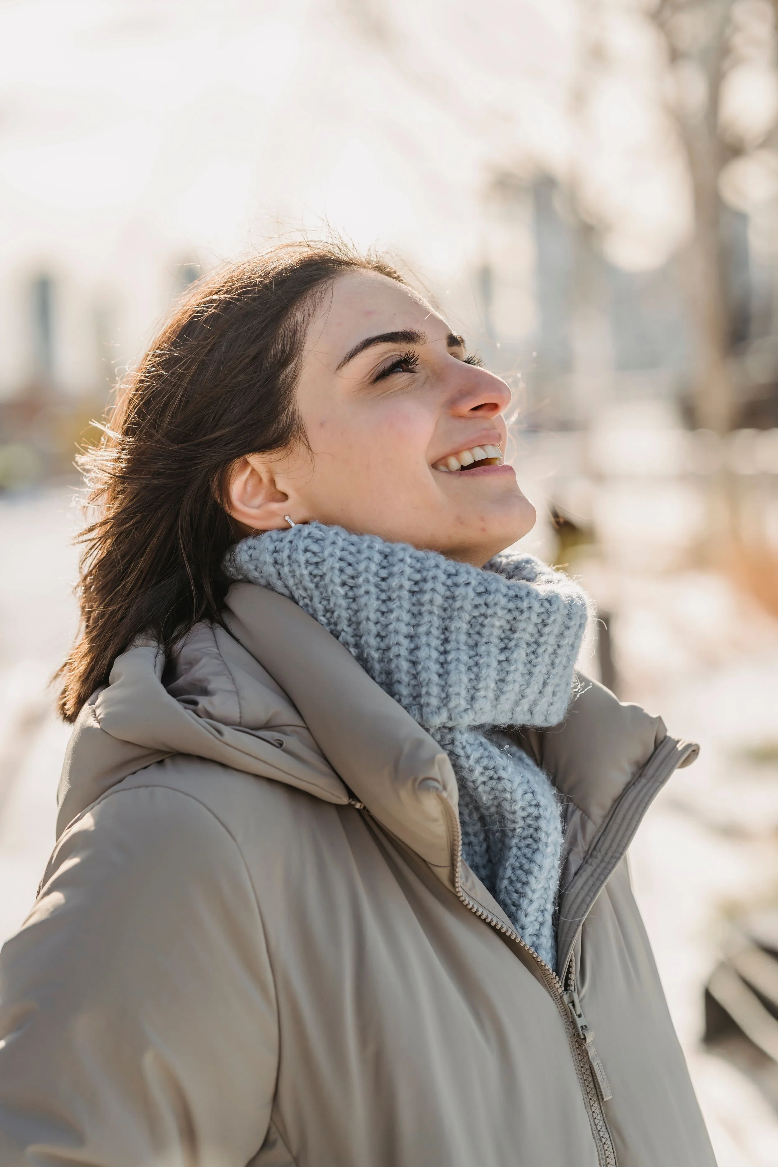 Woman walking outdoors alone looking calm and grounded, representing healthy distance from family without estrangement