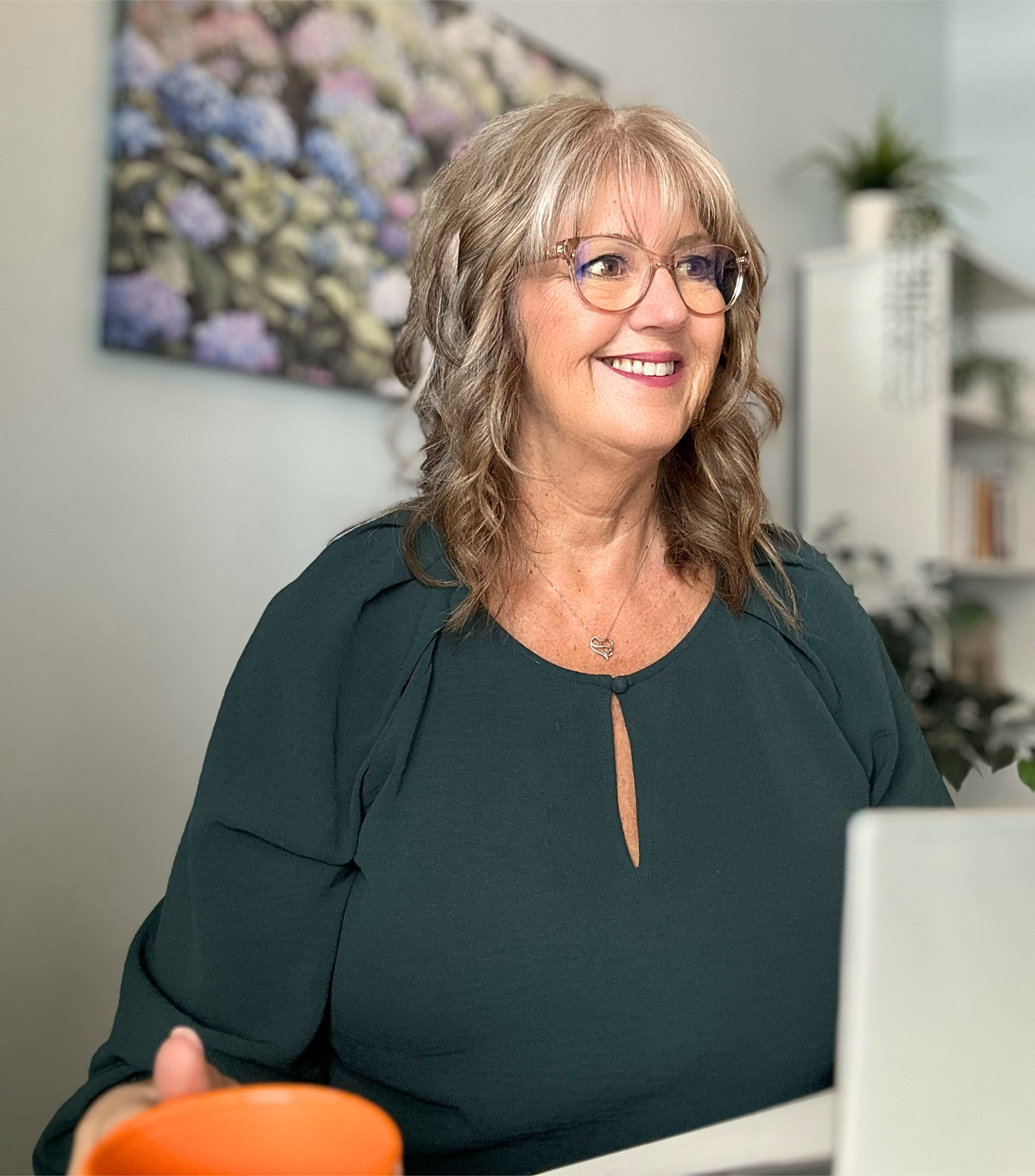 Senior HR consultant working with small business clients in a home office setting in Nova Scotia.