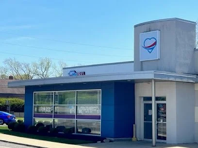 Exterior of a MyUSA Credit Union branch with large front windows and a blue facade.