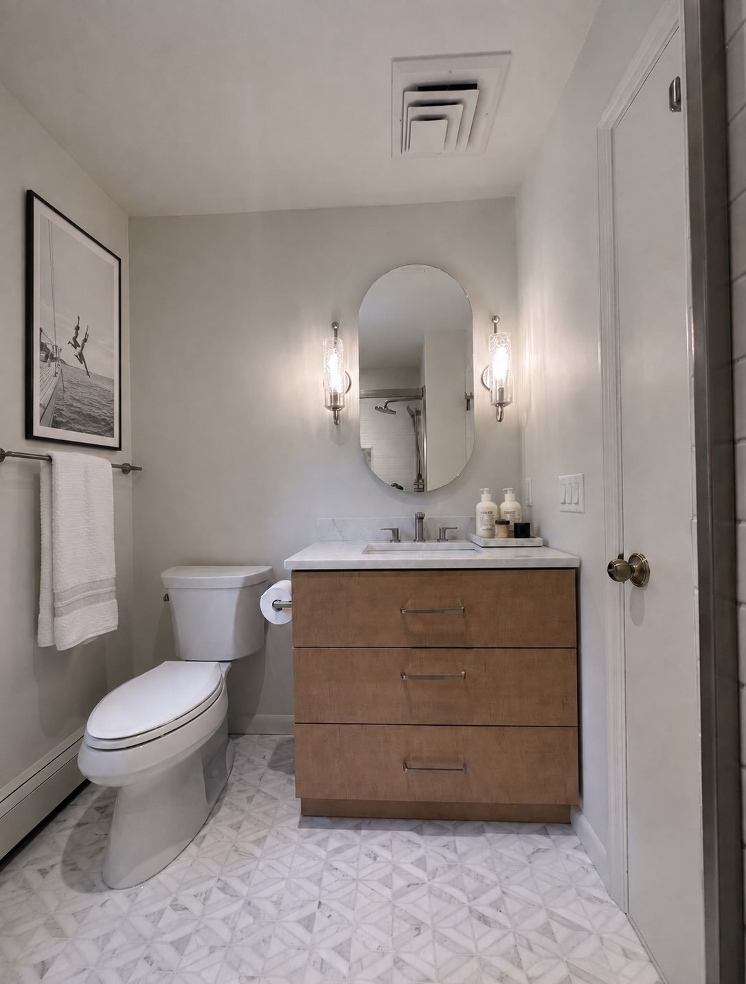 Calacatta Gold mosaic floors paired with brushed nickel fixtures create the perfect balance of warm and cool tones for a spa-like guest bathroom. 

#bathroomdesign  #calacattagold #spabathroom #subwaytile #marblefloors