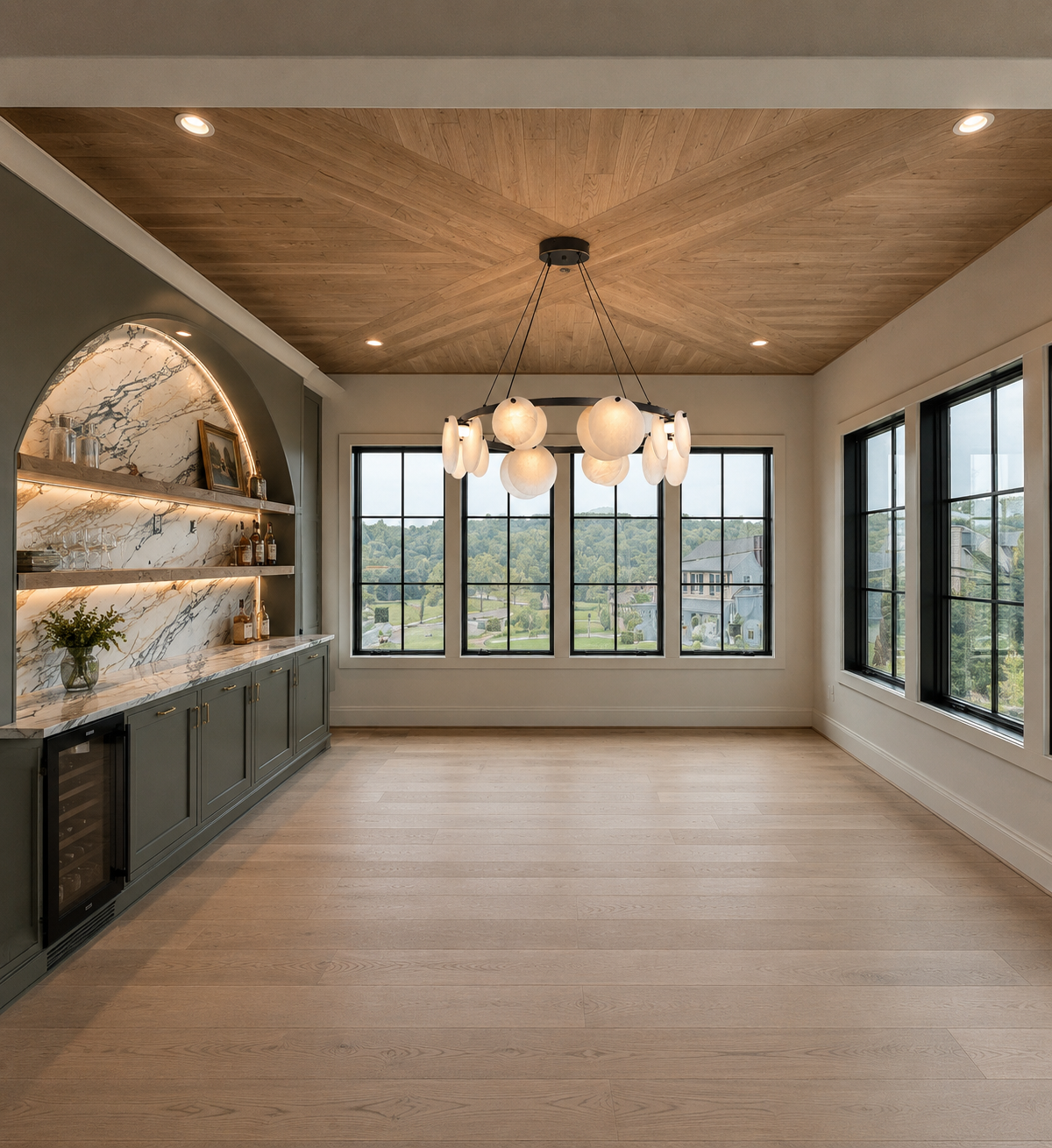Empty dining room with large windows, wooden ceiling, hanging modern chandelier, built-in bar area with marble backsplash, green cabinets, and light wooden floor.