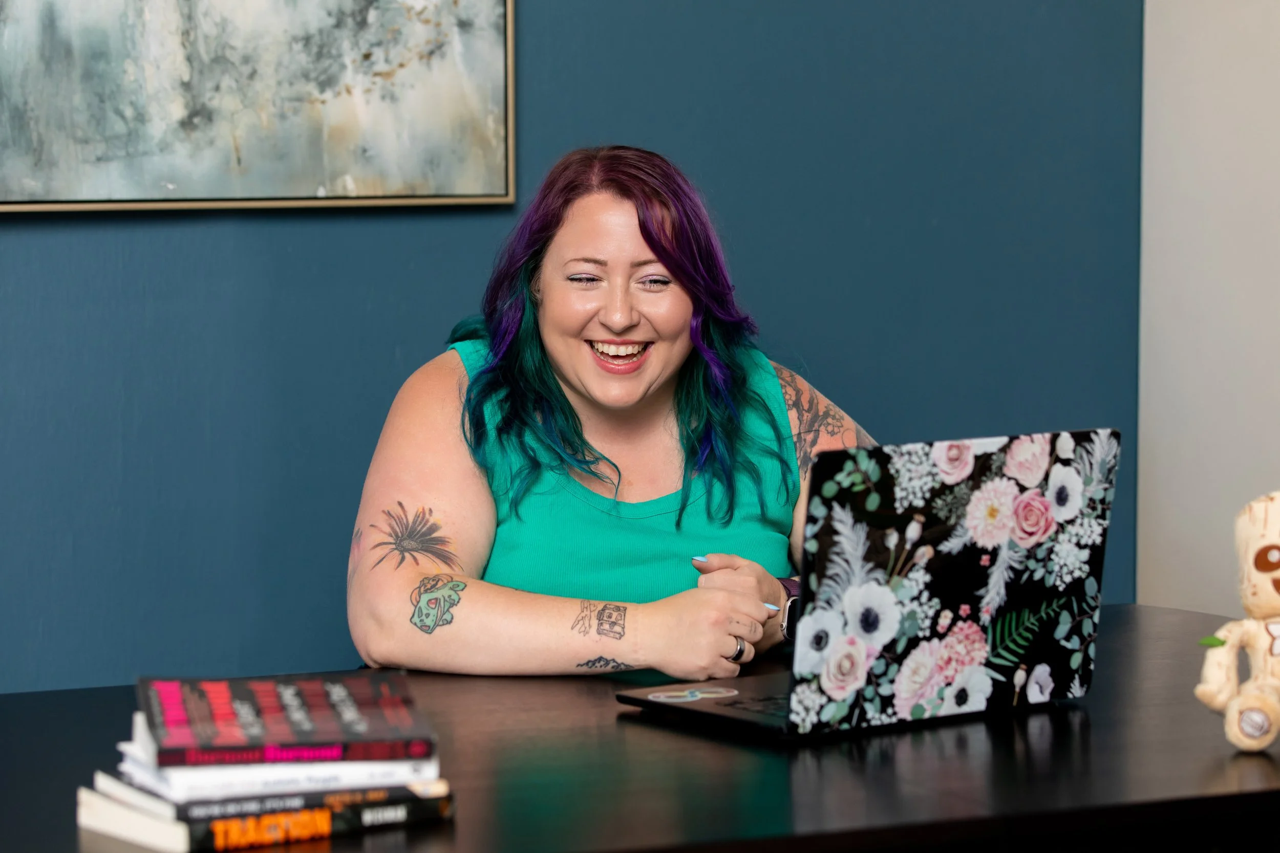 Samantha Willi working at her desk on a laptop