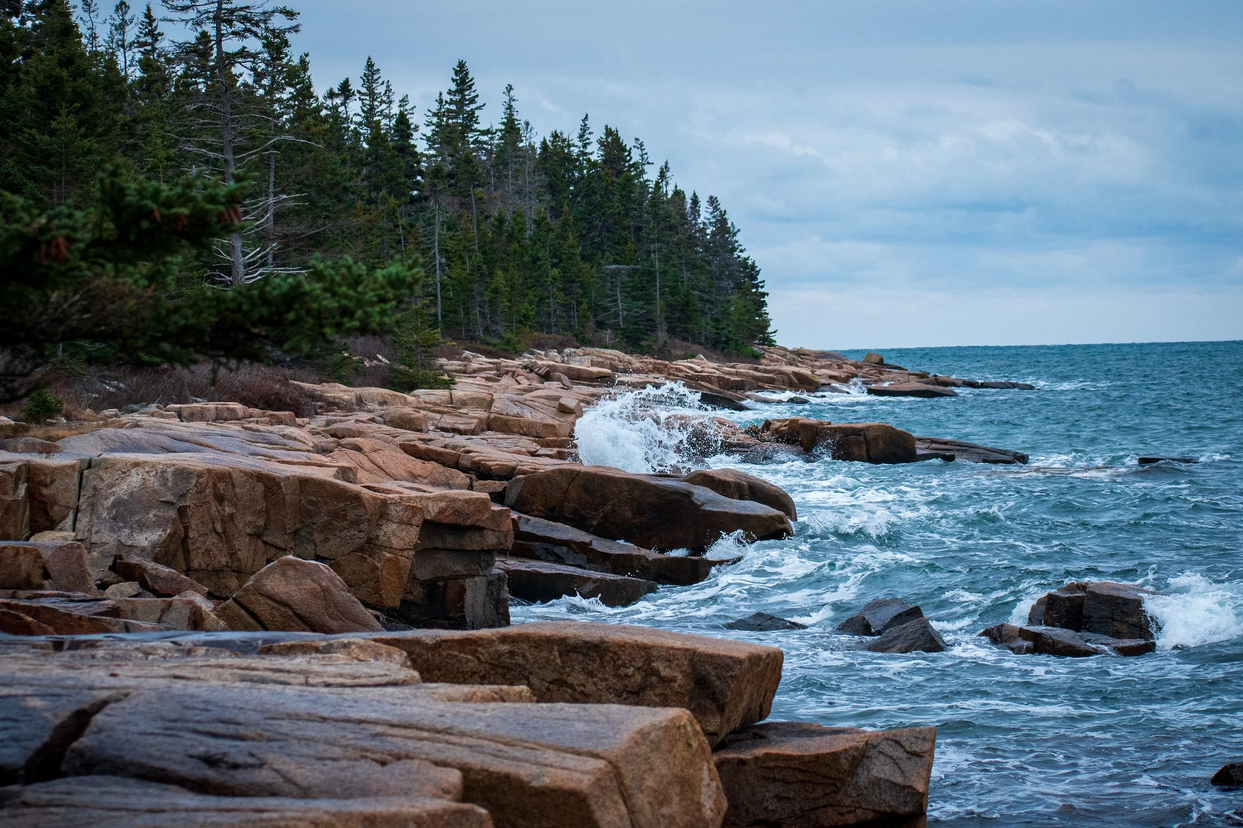 Winter swells along the coast of Acadia national park’s rugged coastline show off beautiful pops of foam amongst the rocks. 