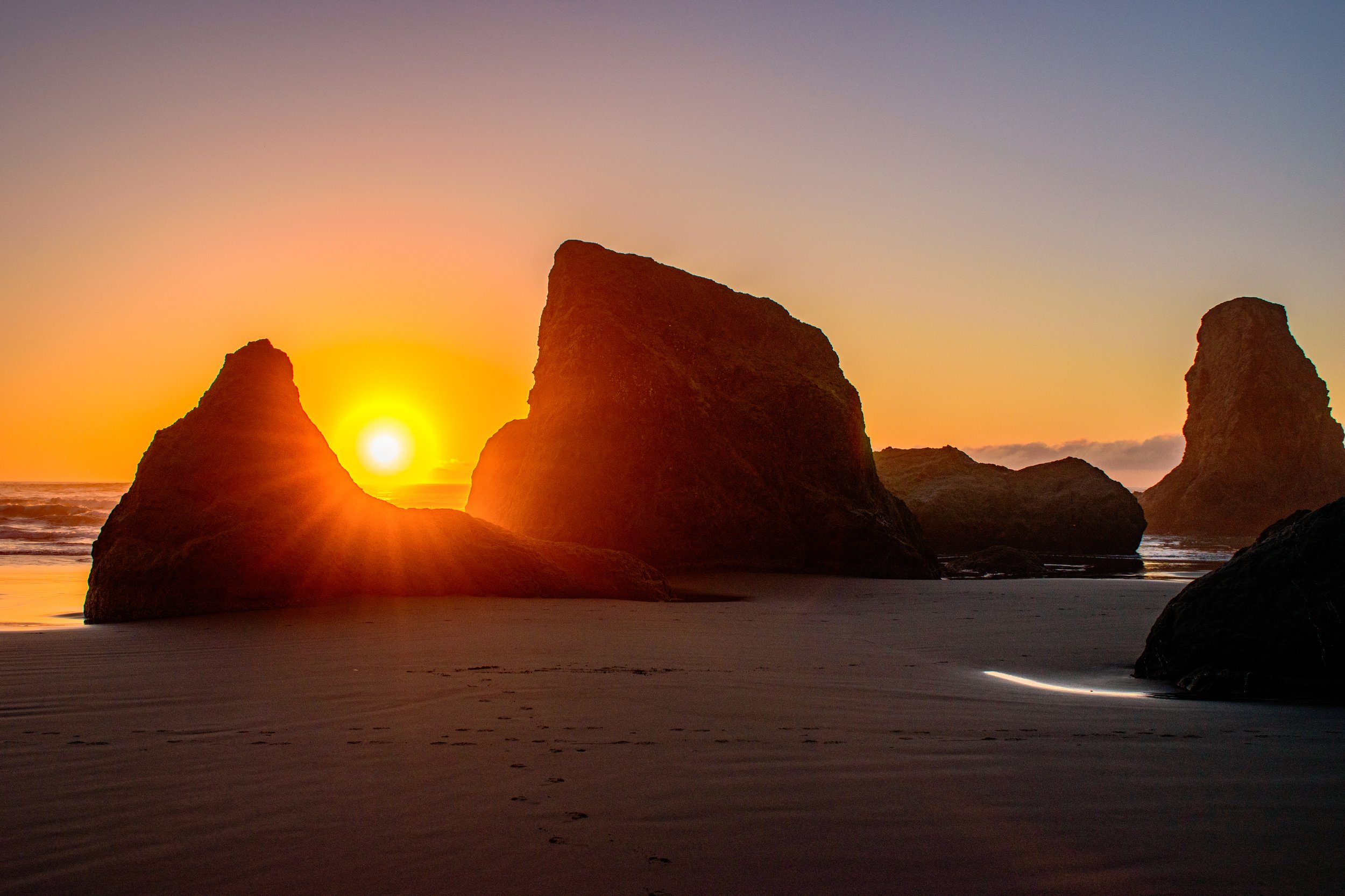 Sunset rays of the Oregon coast make for the dream beach getaways. The stark rays cutting through the rocky formations create quite the contrast.