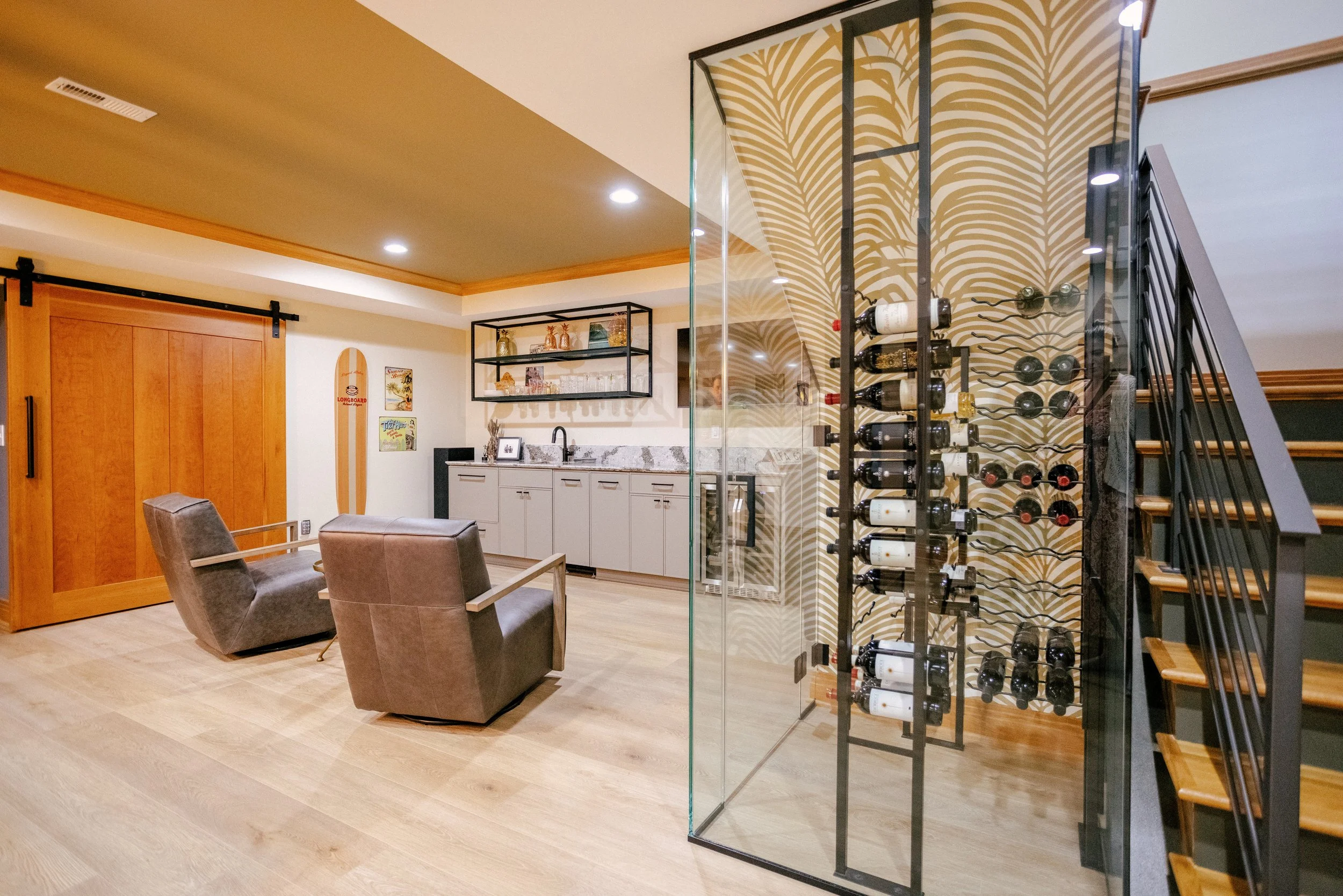 Basement with exposed wine cellar and wet bar.