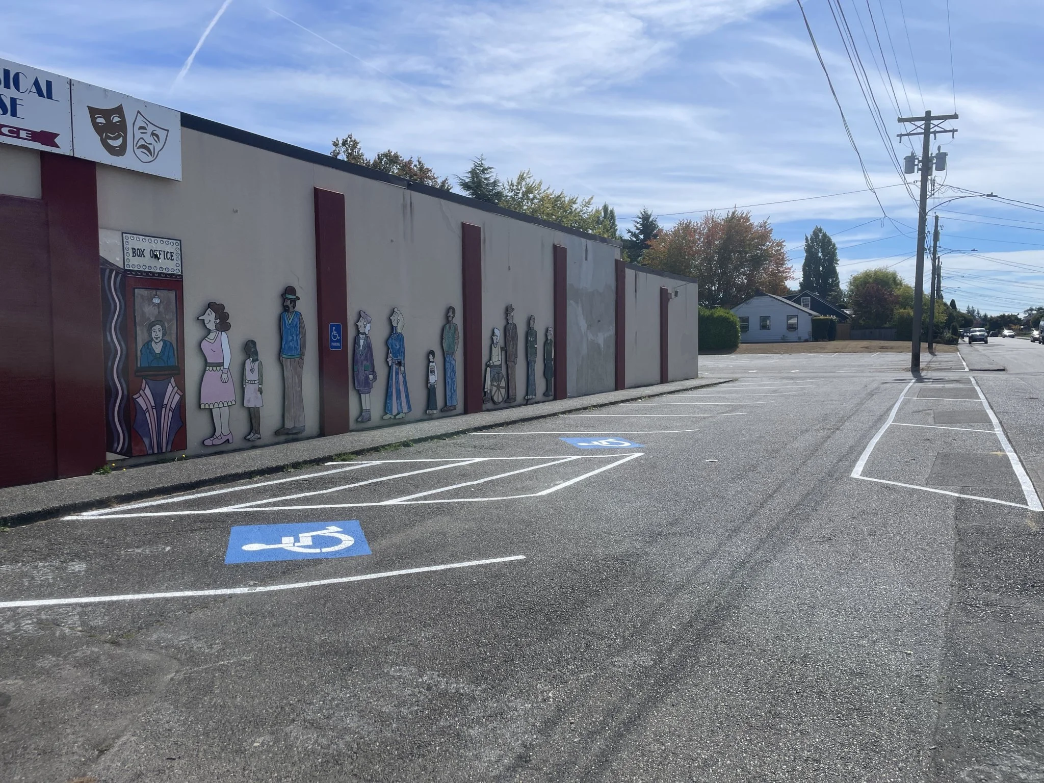 New ADA-accessible parking stalls with fresh blue markings and a striped access aisle, painted to code.