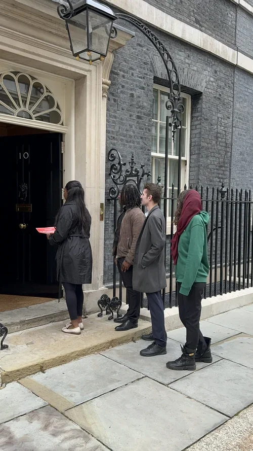 Young people delivering a petition to Downing Street