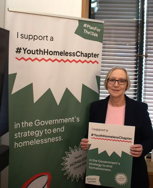 Gill Furniss MP holding a sign in support of the #Planforthe136k