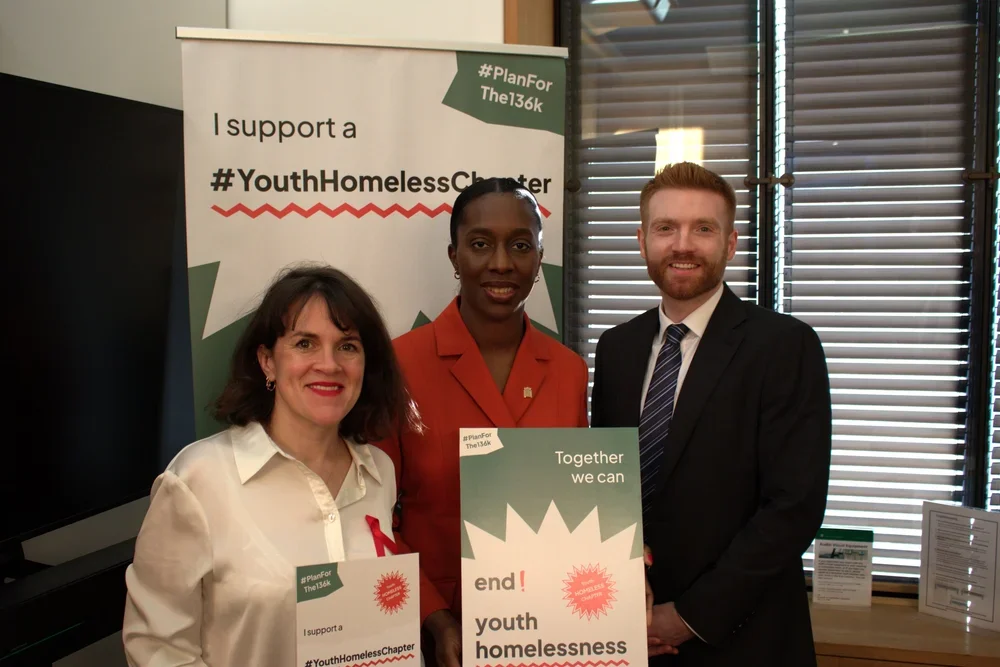 Danny Beales MP, Rachel Blake MP, and Florence Eshalomi MP holding up signs in support of the #Planforthe136K