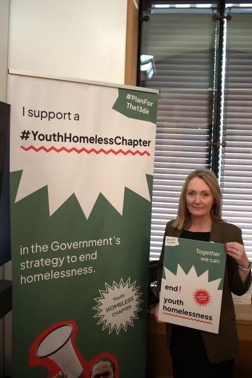 Jo Platt MP holding a sign in support of the #Planforthe136K