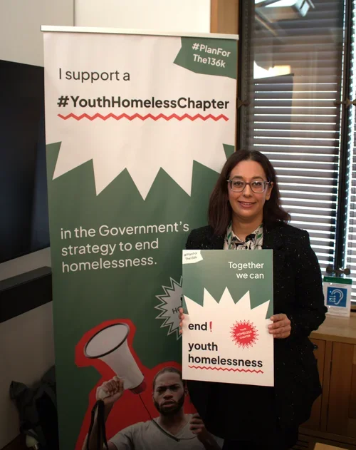 Harpreet Uppal MP holding a sign in support of the #Planforthe136K