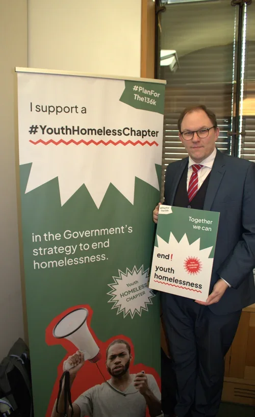 Gareth Snell MP holding a sign in support of the #Planforthe136K