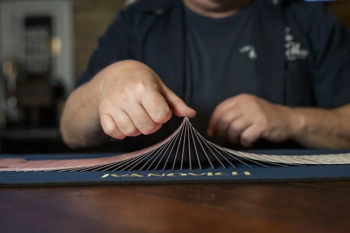 Magician performing a magic trick with cards.