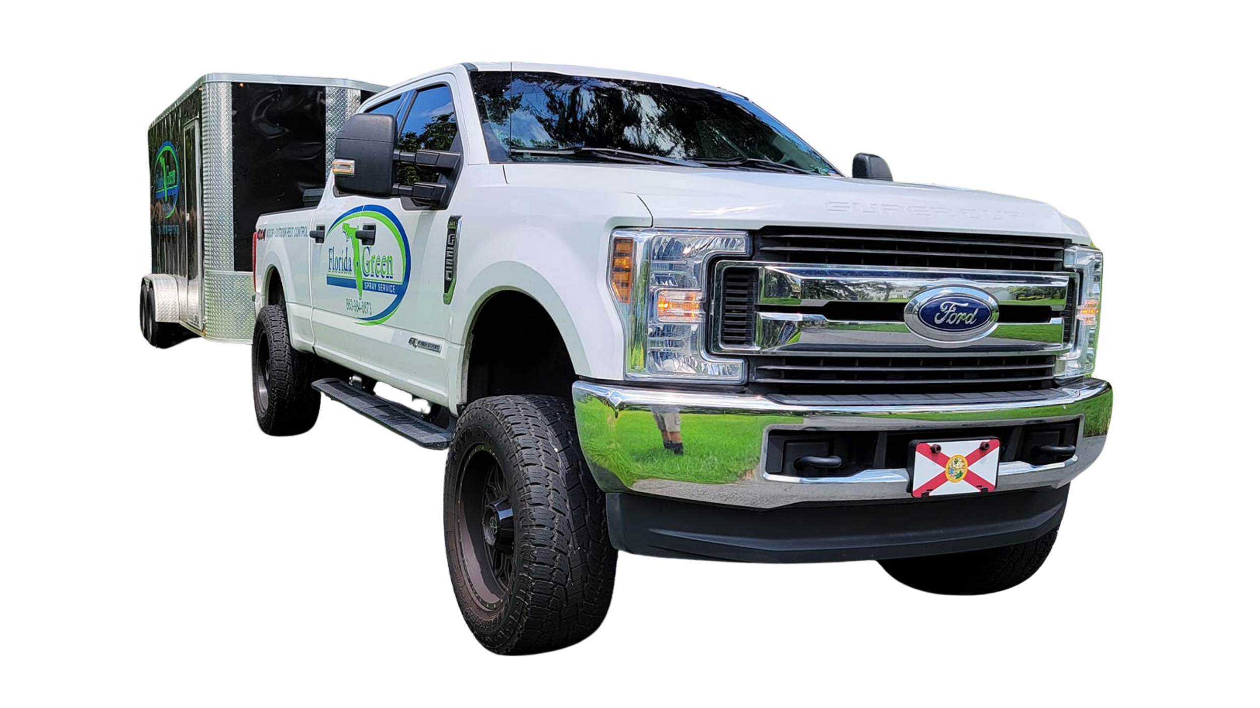 White pickup truck with logo that says Florida Green Spray Service, attached to a trailer, parked on grass.