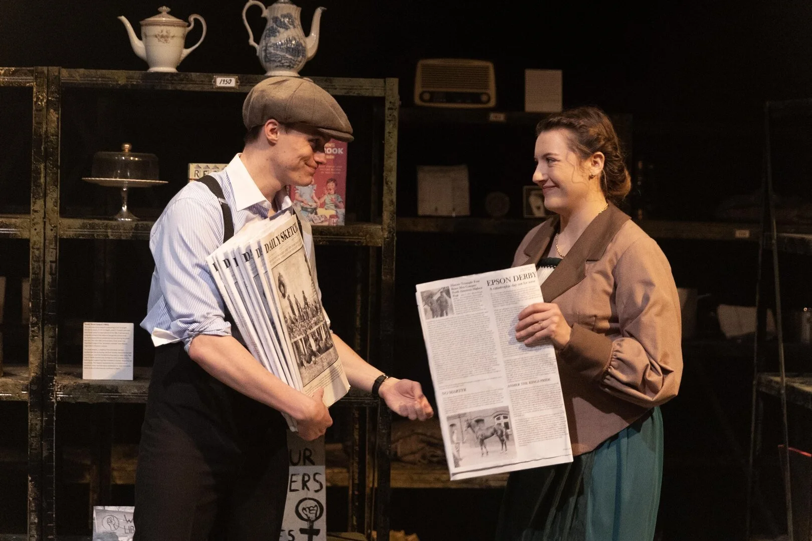 Her Naked Skin production photo including photoshop newspapers  -  Set Design Maisie Frater  -  Costume Design Morgan Mcdonald  -  Photography Craig Fuller