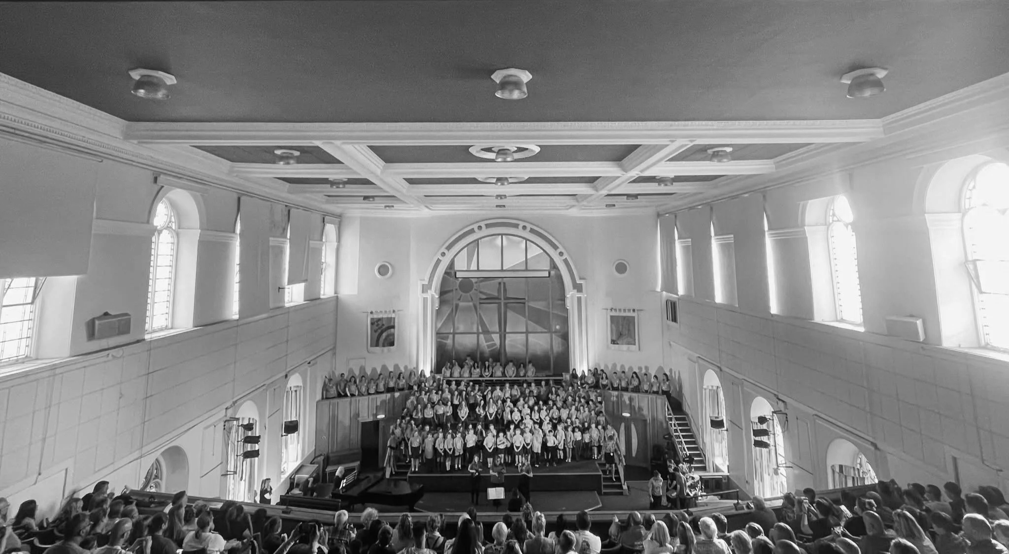 Choir singing in a large hall